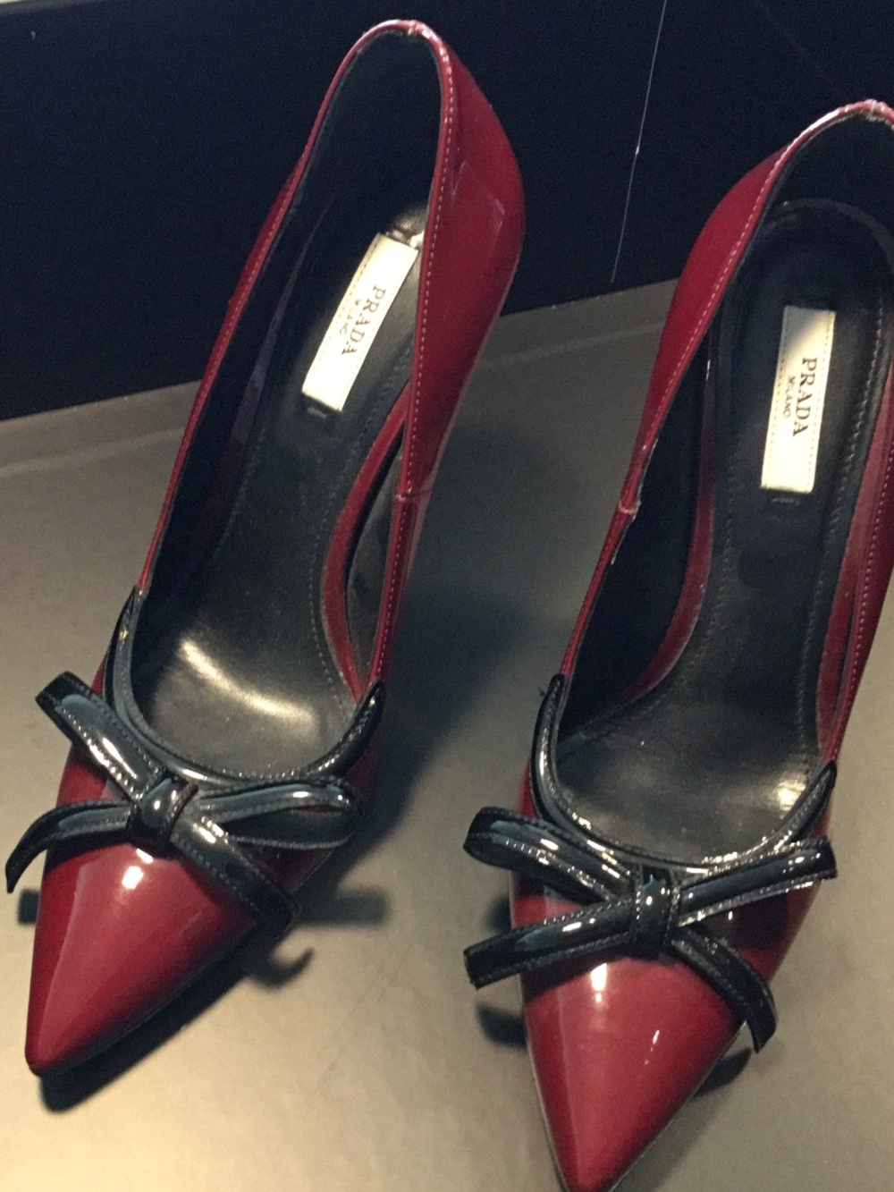 Prada Burgundy patent pointed toe bow pumps